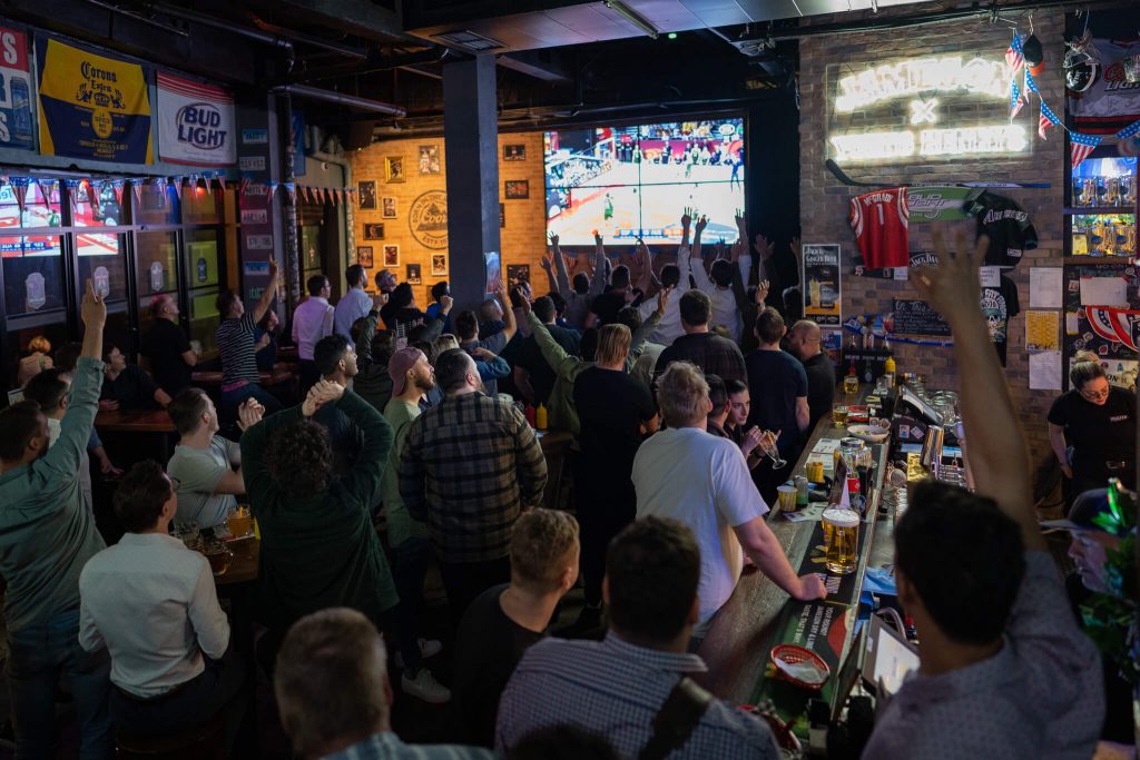Fans watching the game on the big screen